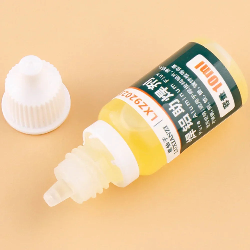 Opened 10 ml yellow aluminum and multi-metal soldering flux bottle with precision tip