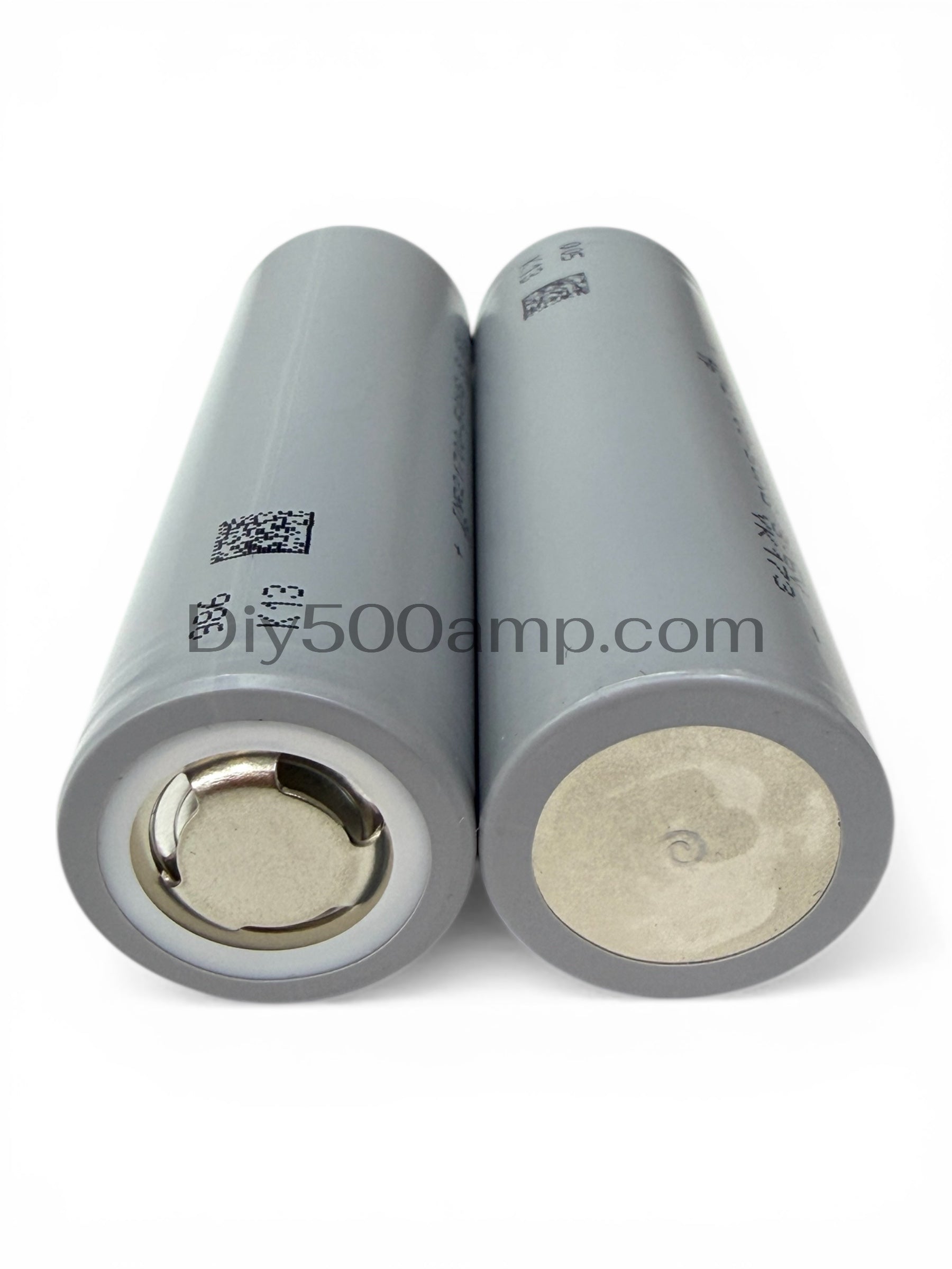 Two Reliance RS50 21700 5000mAh 70A tabless lithium-ion battery cells, bottom view